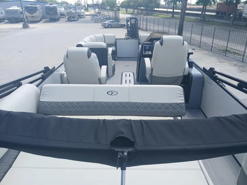 Slide: The Image of 2023 Veranda VP22VLC pontoon boat interior with plush seating and modern design. - 20