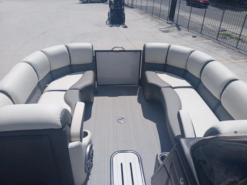 Slide: The Image of 2023 Veranda VP22VLC pontoon boat interior with plush seating and spacious layout. - 25