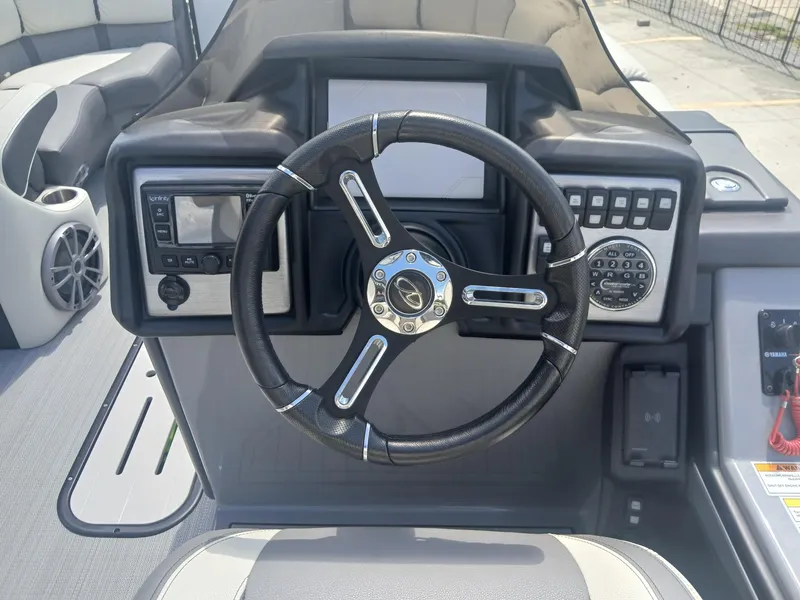 Slide: The Image of 2023 Veranda VP22VLC boat dashboard with steering wheel and control panel. - 6