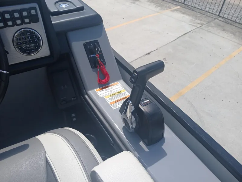 Slide: The Image of 2023 Veranda VP22VLC boat control panel with throttle and safety features. - 7