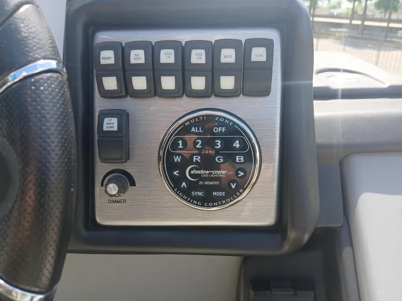 Slide: The Image of Control panel of 2023 Veranda VP22VLC boat with switches and lighting controller. - 8