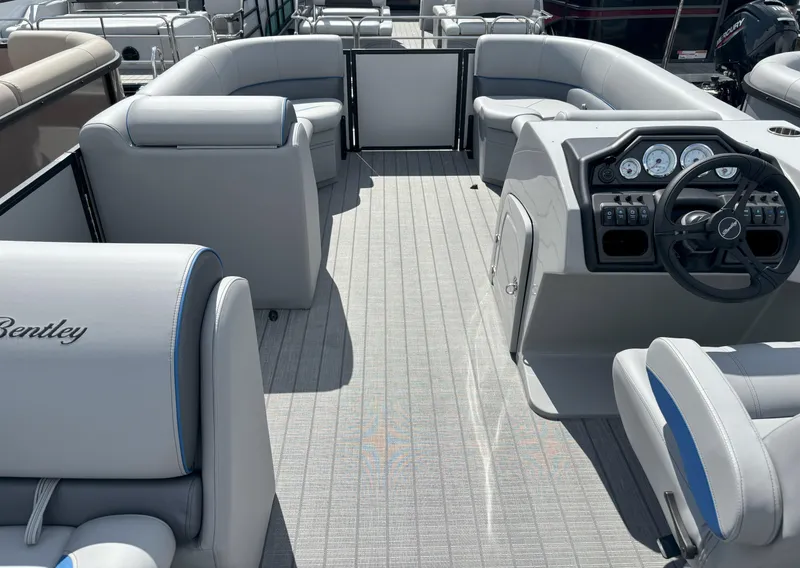 Slide: The Image of 2025 Bentley Pontoons Legacy 223 Cruise XL interior with luxurious seating and modern dashboard. - 13