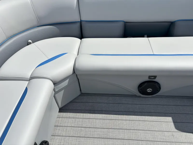 Slide: The Image of 2025 Bentley Pontoons Legacy 223 Cruise XL interior seating with speaker, gray and blue accents. - 22