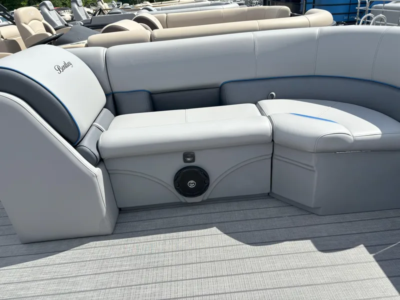 Slide: The Image of 2025 Bentley Pontoons Legacy 223 Cruise XL interior seating with speaker, gray upholstery. - 3