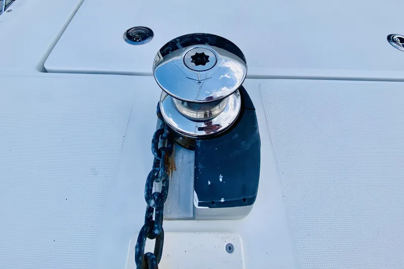 Slide: The Image of Anchor winch on 2019 Lagoon 42 Owners Version catamaran deck. - 14