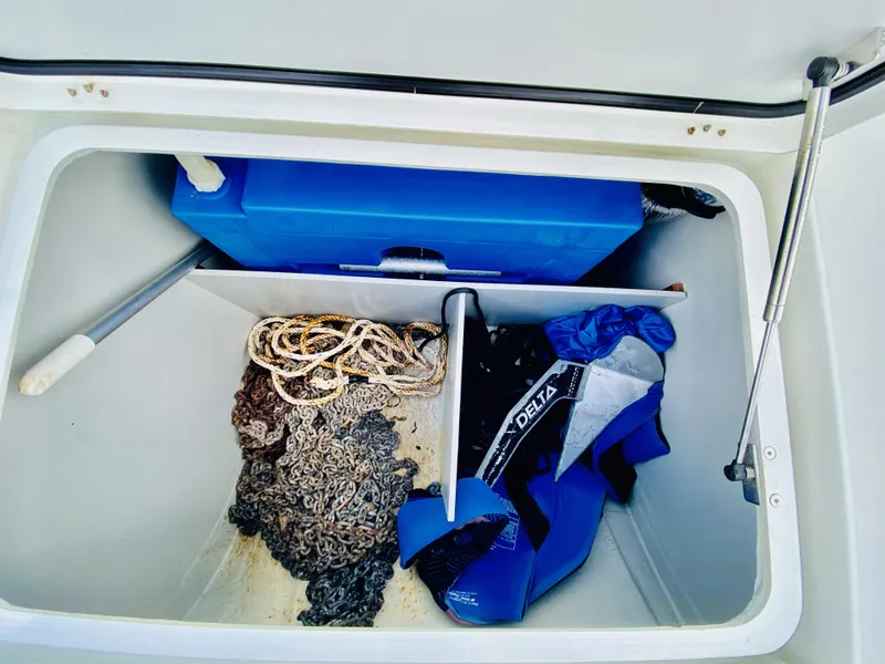 Slide: The Image of Storage compartment on 2019 Lagoon 42 Owners Version with anchor chain, rope, and diving gear. - 15