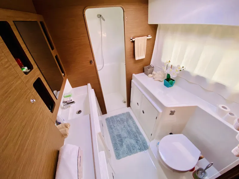 Slide: The Image of Luxurious bathroom in 2019 Lagoon 42 Owners Version catamaran with modern fixtures and shower. - 27