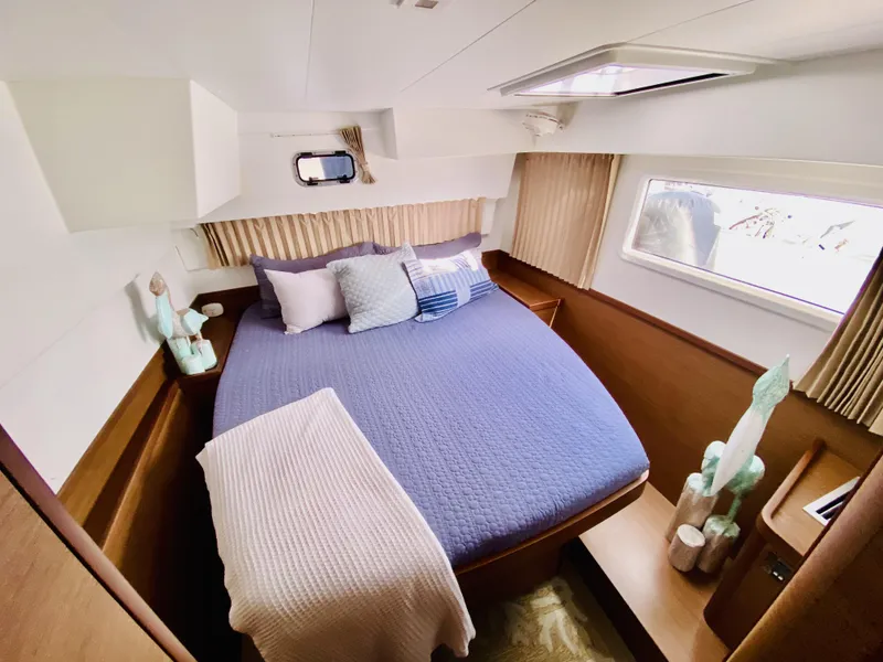 Slide: The Image of Luxurious bedroom in 2019 Lagoon 42 Owners Version catamaran, featuring cozy bedding and modern decor. - 34