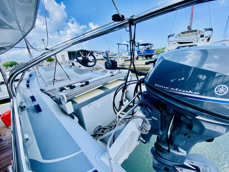 Slide: The Image of 2019 Lagoon 42 Owners Version yacht with Yamaha outboard motor, docked in a marina. - 43