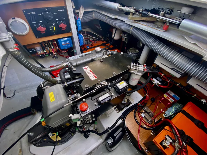 Slide: The Image of Engine room of a 2019 Lagoon 42 Owners Version catamaran, showcasing mechanical components and wiring. - 46