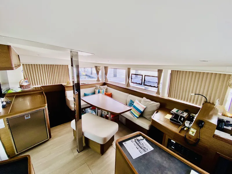 Slide: The Image of Spacious interior of 2019 Lagoon 42 Owners Version catamaran with modern furnishings and ample seating. - 17
