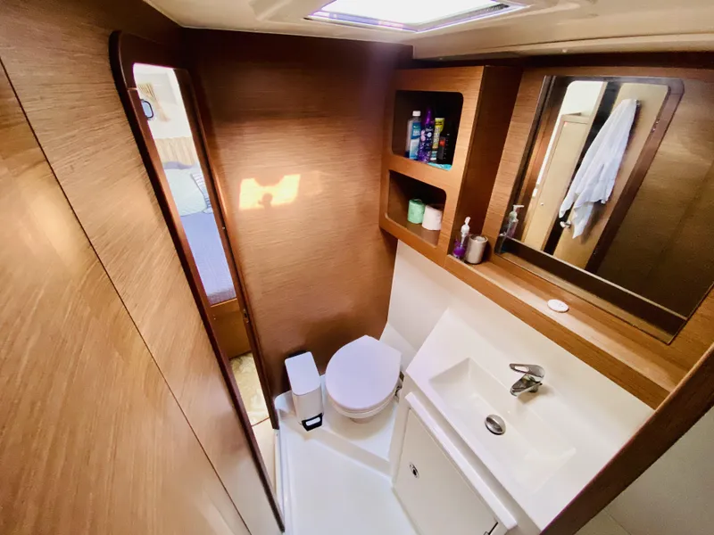 Slide: The Image of Luxurious bathroom in 2019 Lagoon 42 Owners Version yacht, featuring modern fixtures and wood accents. - 38