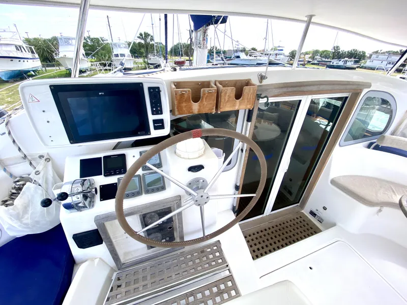 Slide: The Image of Steering area of a 2006 Privilege 435 yacht with navigation equipment. - 12