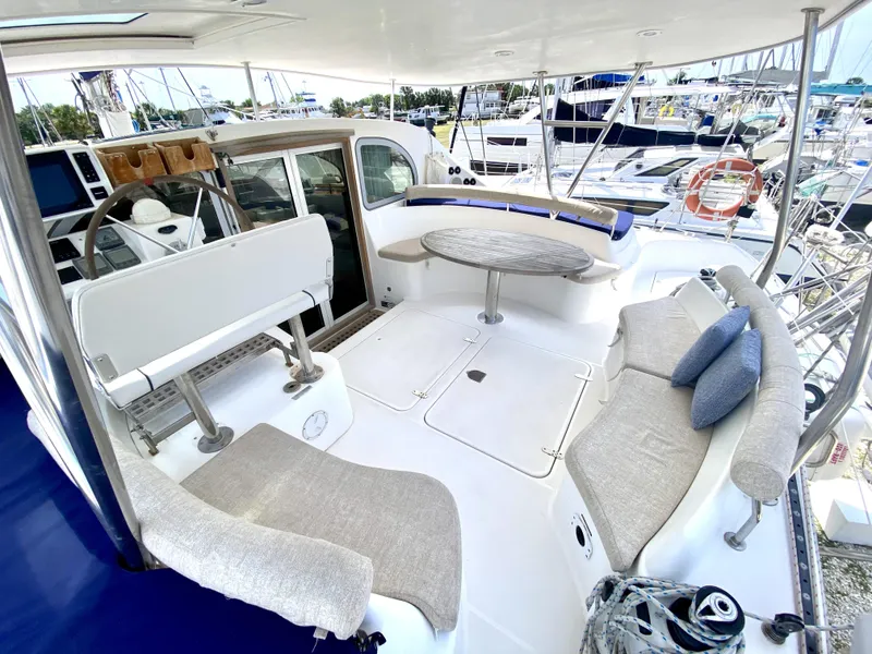 Slide: The Image of Spacious deck of 2006 Privilege 435 yacht with comfortable seating and table. - 13