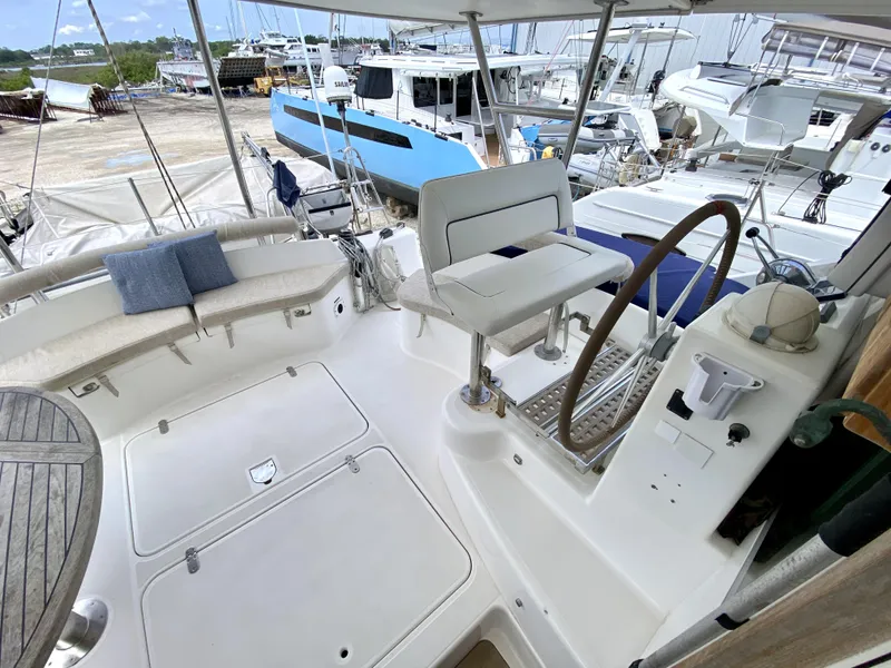 Slide: The Image of Spacious cockpit of 2006 Privilege 435 yacht with seating and steering wheel. - 16