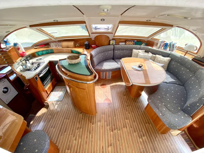 Slide: The Image of Luxurious 2006 Privilege 435 yacht interior with elegant wood finish and spacious seating area. - 2