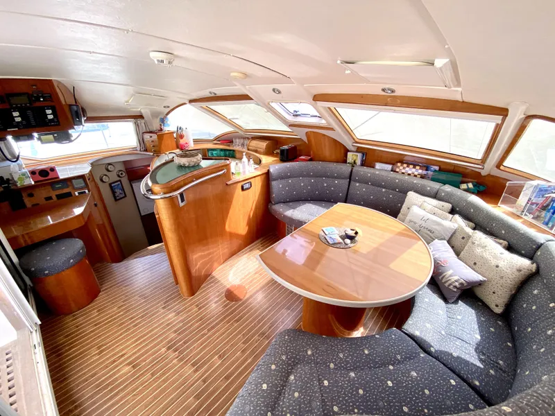 Slide: The Image of Luxurious interior of a 2006 Privilege 435 yacht with elegant seating and wooden finishes. - 20