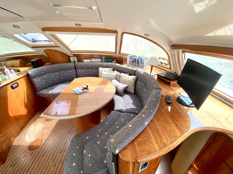 Slide: The Image of Luxurious interior of 2006 Privilege 435 yacht with cozy seating and modern amenities. - 21
