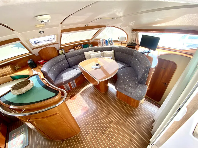 Slide: The Image of Luxurious 2006 Privilege 435 yacht interior with elegant seating and wooden finishes. - 22