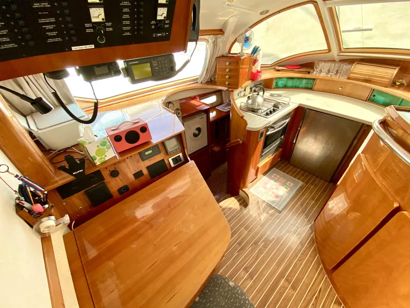 Slide: The Image of Interior of 2006 Privilege 435 yacht with wooden finishes and modern kitchen amenities. - 23