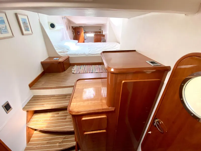 Slide: The Image of Luxurious interior of 2006 Privilege 435 yacht with wooden finishes and cozy bedroom. - 31
