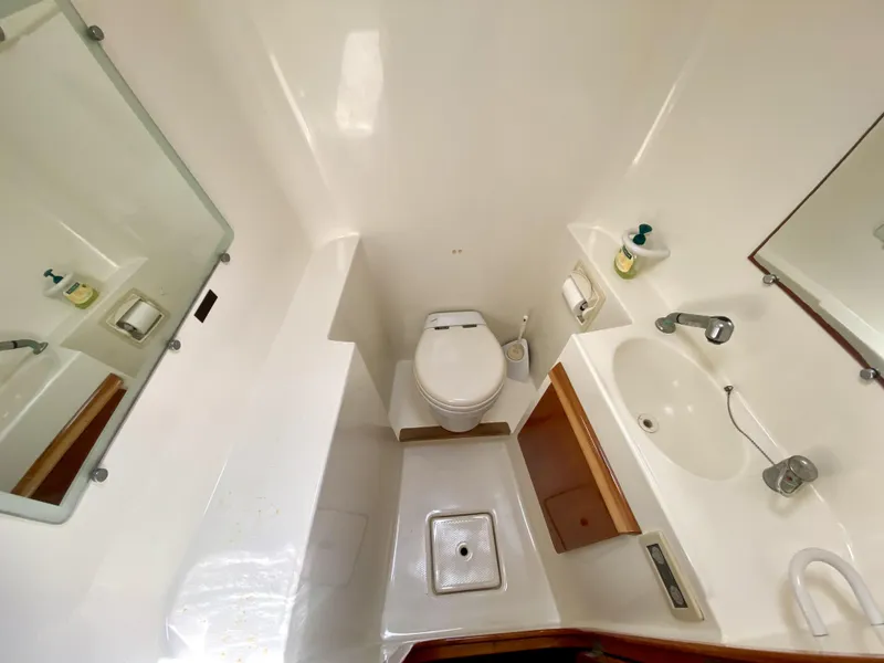 Slide: The Image of Compact bathroom in 2006 Privilege 435 yacht with toilet, sink, and mirror. - 33