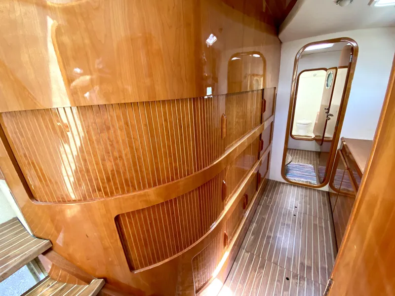 Slide: The Image of Luxurious wooden interior of 2006 Privilege 435 yacht, featuring elegant design and craftsmanship. - 36