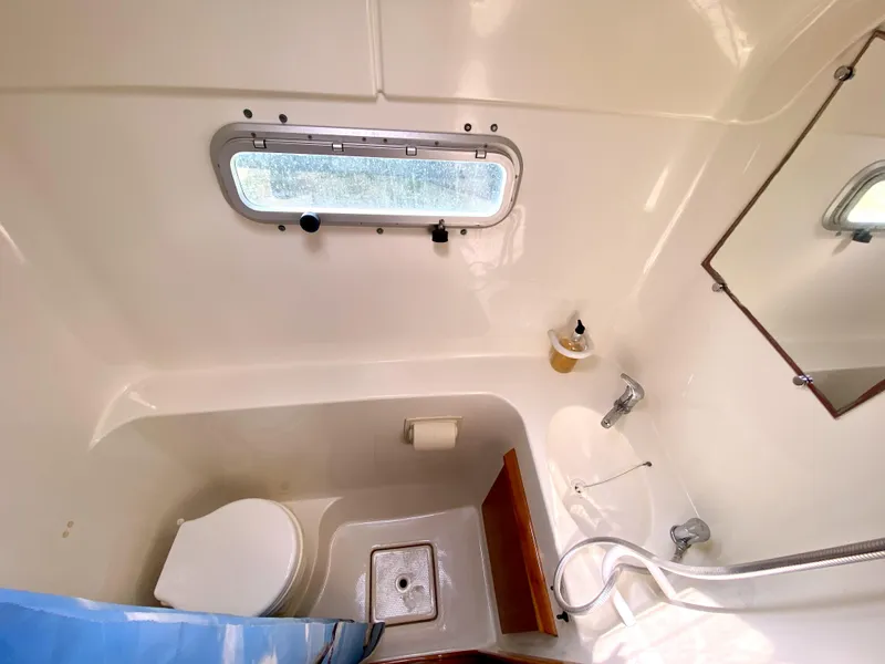 Slide: The Image of Compact bathroom in 2006 Privilege 435 yacht with toilet, sink, and window. - 37
