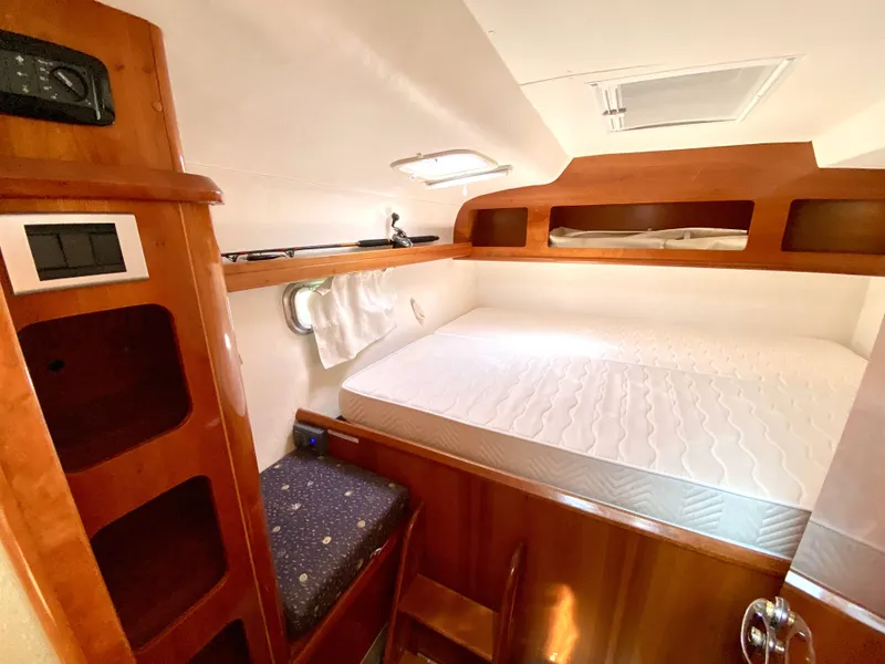 Slide: The Image of Cozy cabin interior of 2006 Privilege 435 yacht with wooden finish and comfortable bedding. - 38