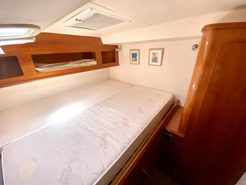 Slide: The Image of Cozy cabin interior of 2006 Privilege 435 yacht with wooden accents and double bed. - 40