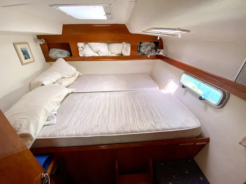 Slide: The Image of Cozy cabin interior of 2006 Privilege 435 yacht with double bed and porthole. - 45