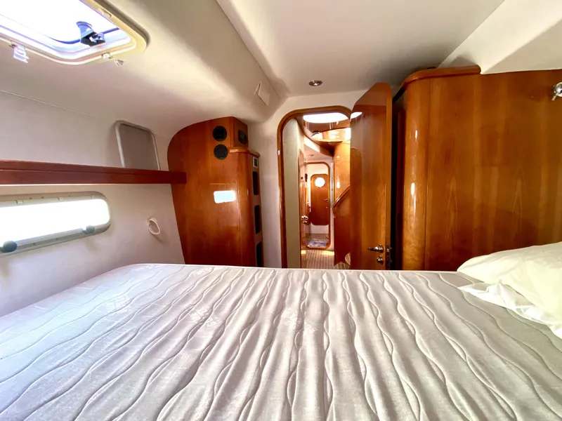 Slide: The Image of Luxurious cabin interior of 2006 Privilege 435 yacht with wooden finishes and cozy bedding. - 47