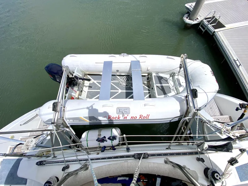 Slide: The Image of Aerial view of a 2006 Privilege 435 yacht with an inflatable dinghy on deck. - 48