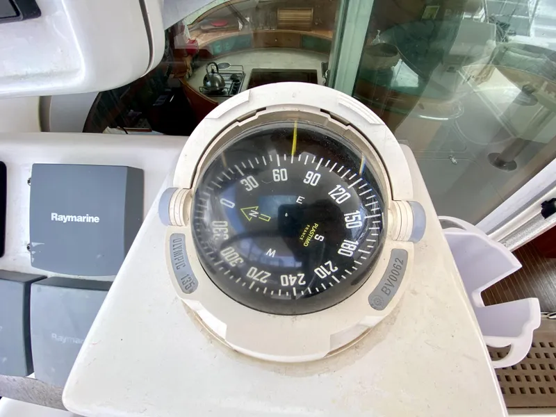 Slide: The Image of Compass on 2006 Privilege 435 yacht, with Raymarine equipment visible nearby. - 49