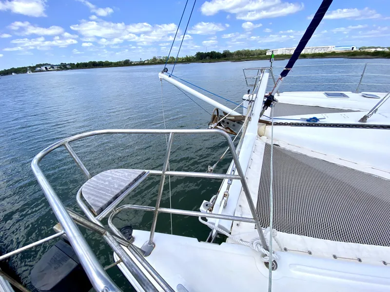 Slide: The Image of Sailing catamaran Privilege 435, 2006 model, on calm waters under a blue sky. - 7