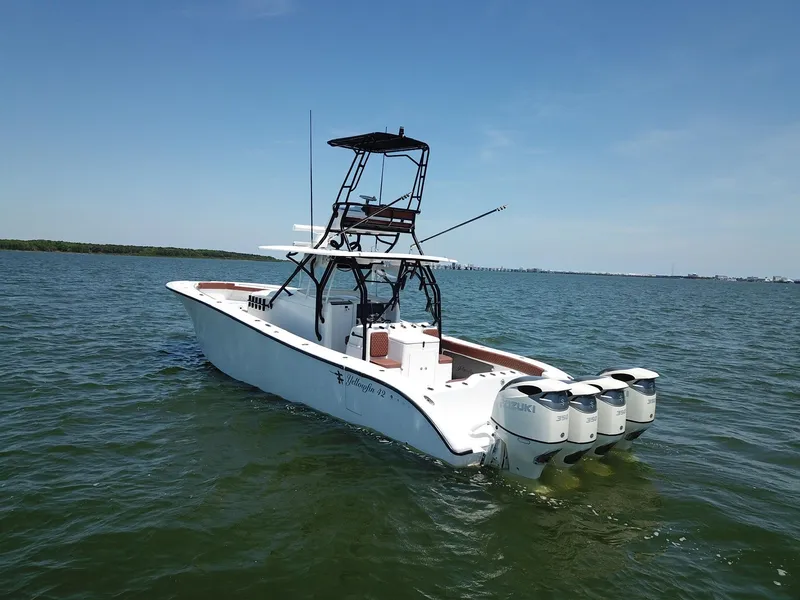 Slide: The Image of 2008 Yellowfin 42 boat with multiple engines on open water. - 1