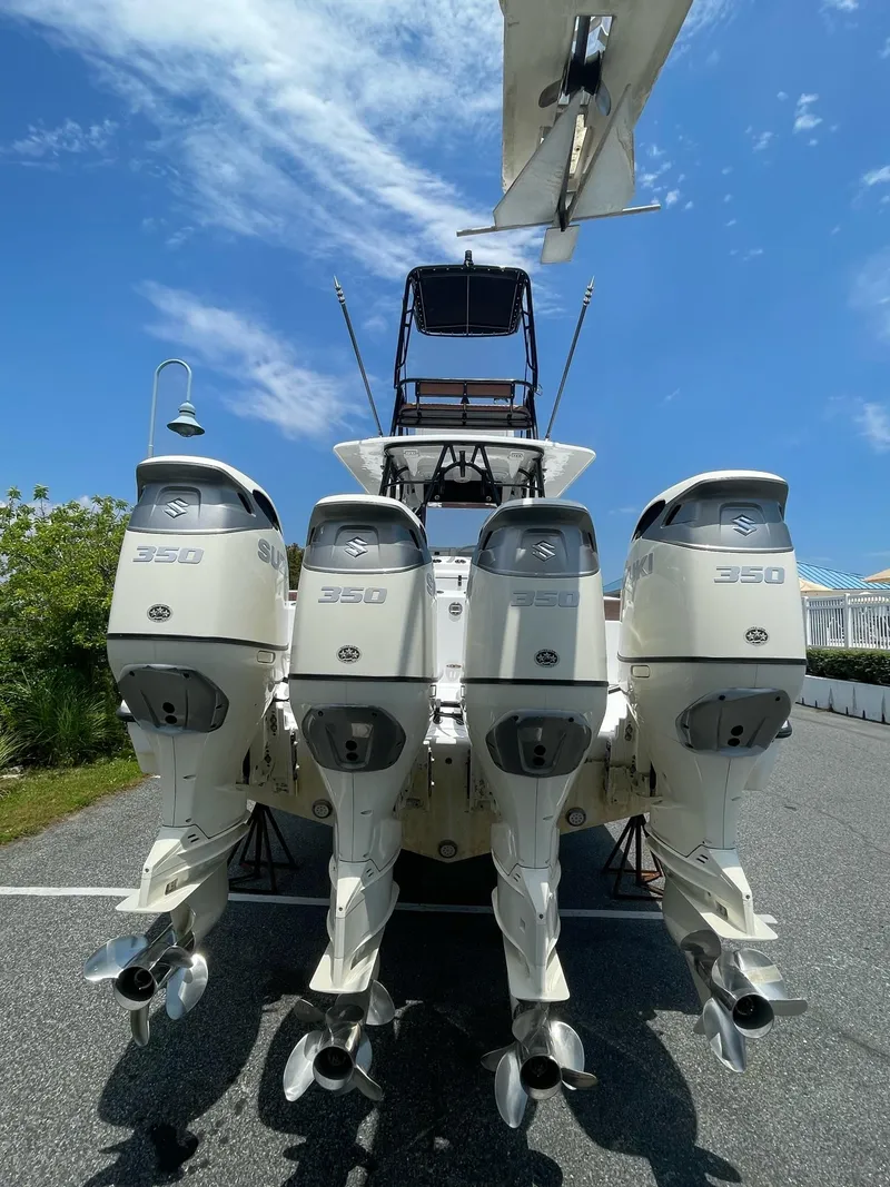 Slide: The Image of 2008 Yellowfin 42 boat with four powerful outboard engines, viewed from the rear. - 11