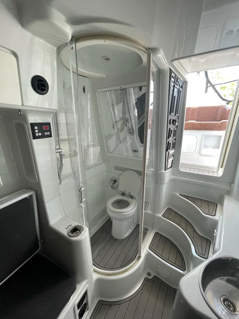 Slide: The Image of 2008 Yellowfin 42 boat bathroom with shower, toilet, and modern fixtures. - 25