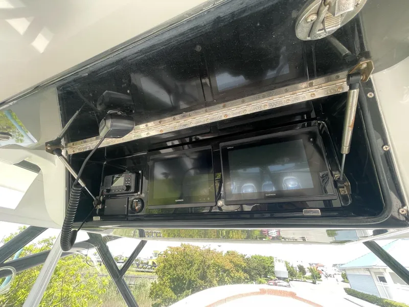 Slide: The Image of 2008 Yellowfin 42 boat dashboard with electronic navigation and communication equipment. - 27