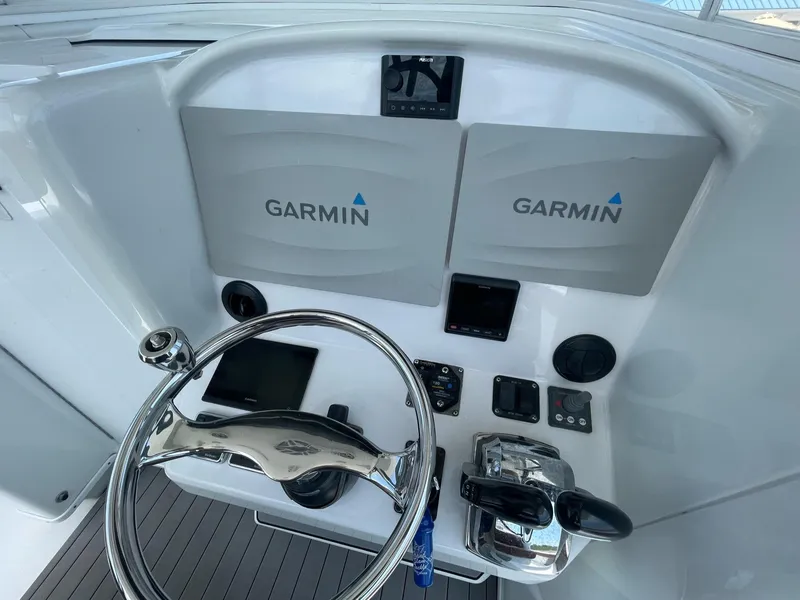 Slide: The Image of Control panel of a 2008 Yellowfin 42 boat with Garmin navigation systems. - 28
