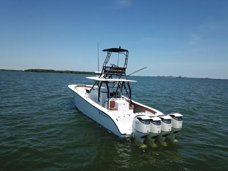 Slide: The Image of 2008 Yellowfin 42 boat with four engines on open water. - 3