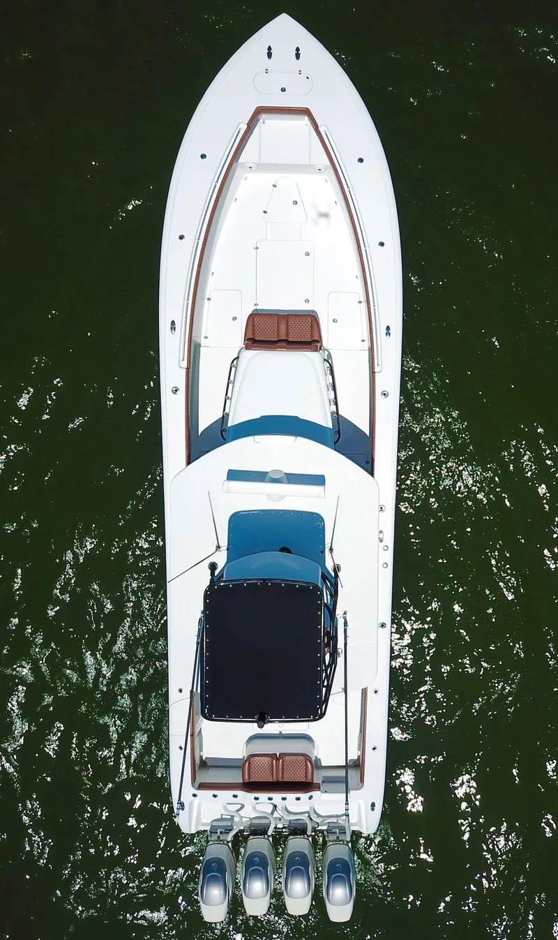 Slide: The Image of Aerial view of a 2008 Yellowfin 42 boat on green water. - 5