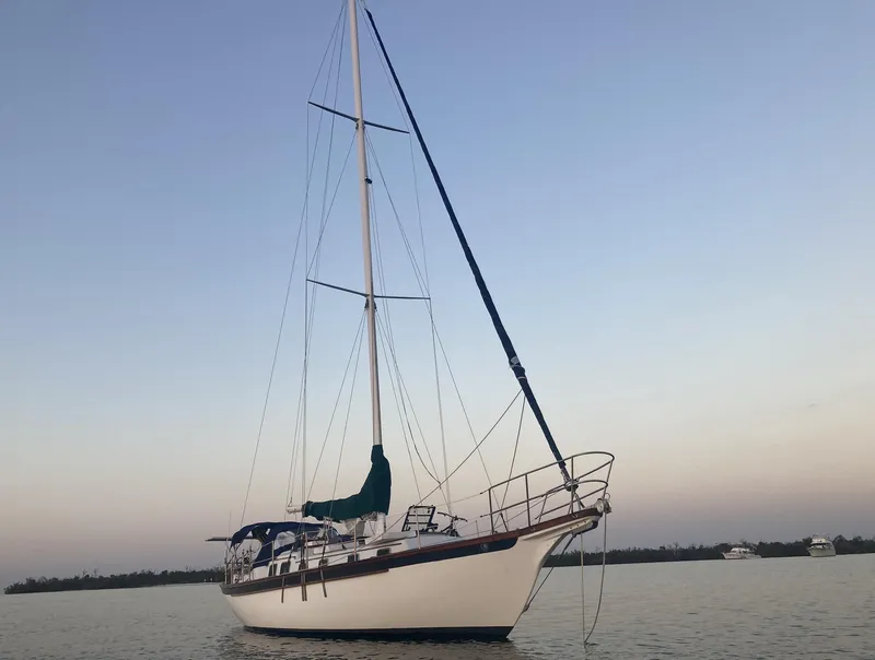 Slide: The Image of Sailboat on calm water at sunset, Durbeck 38, 1983 model. - 1