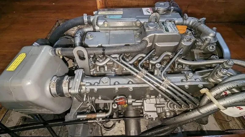 Slide: The Image of 1983 Durbeck 38 yacht bathroom with sink, toilet, and wooden cabinetry. - 14