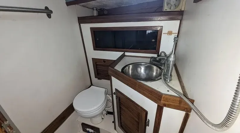 Slide: The Image of Blueprint of 1983 Durbeck 38 sailboat, showing side, cross-section, and top views. - 15