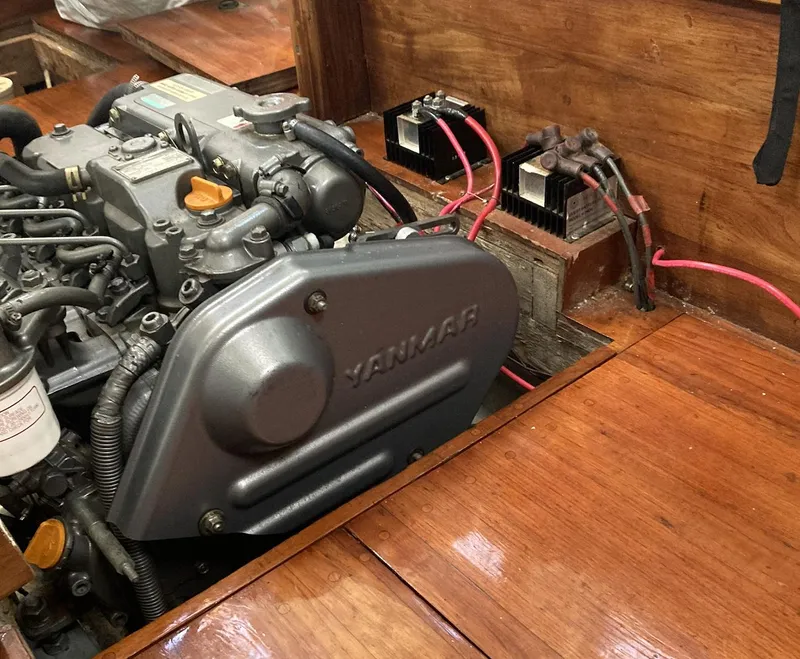 Slide: The Image of Engine compartment of a 1983 Durbeck 38 sailboat with Yanmar engine and electrical components. - 17