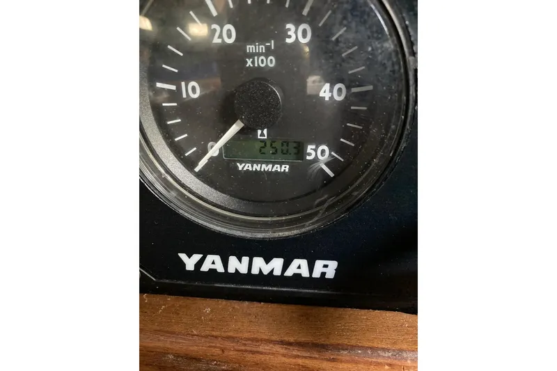 Slide: The Image of 1983 Durbeck 38 engine compartment with visible mechanical components and wiring. - 19