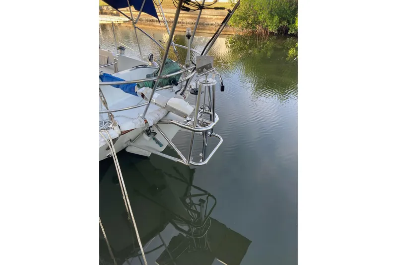 Slide: The Image of White winch on 1983 Durbeck 38 sailboat deck with chain and rope. - 21