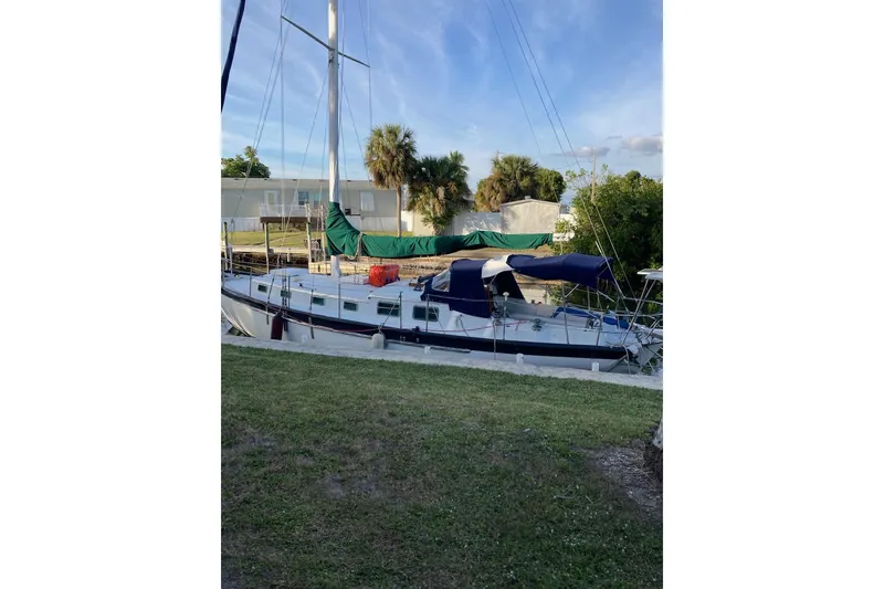Slide: The Image of Interior of 1983 Durbeck 38 sailboat with porthole and wooden accents. - 23