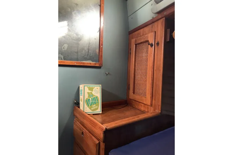 Slide: The Image of Wooden interior of 1983 Durbeck 38 boat with a book on a shelf. - 24